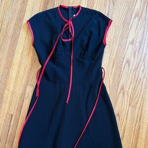 Stop Staring Rockabilly Swing Black dress with red detail.